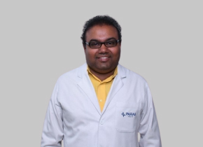 Dr Abhishek Choudhury in a white coat